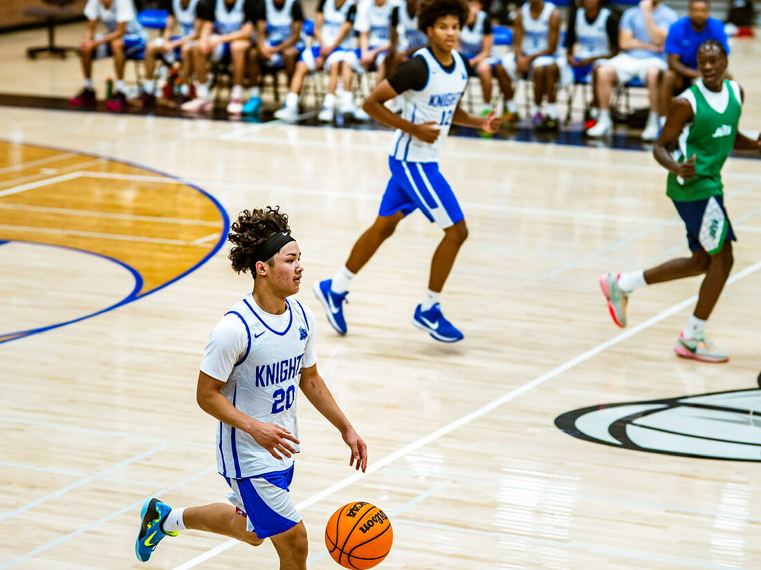 A Knights guard pushing the ball up the floor